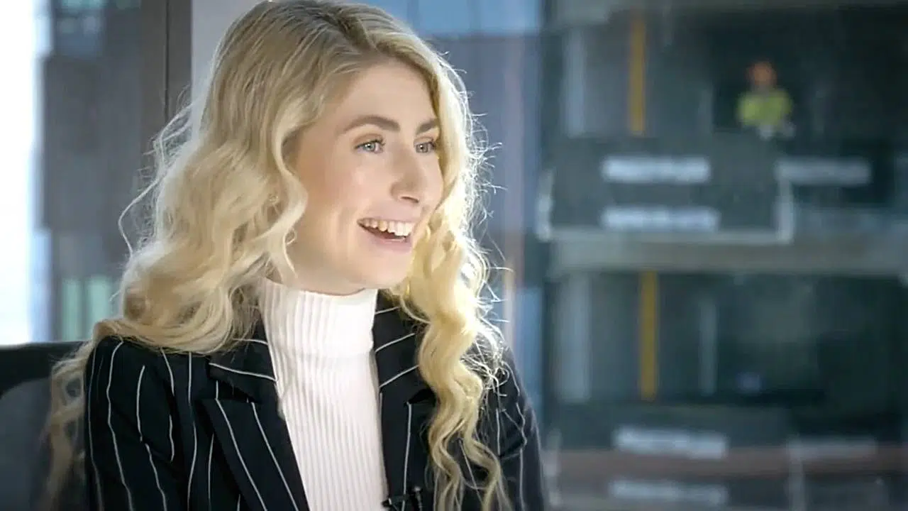 How-to-choose-interviewees-for-your-corporate video Female interviewee in office smiling to camera