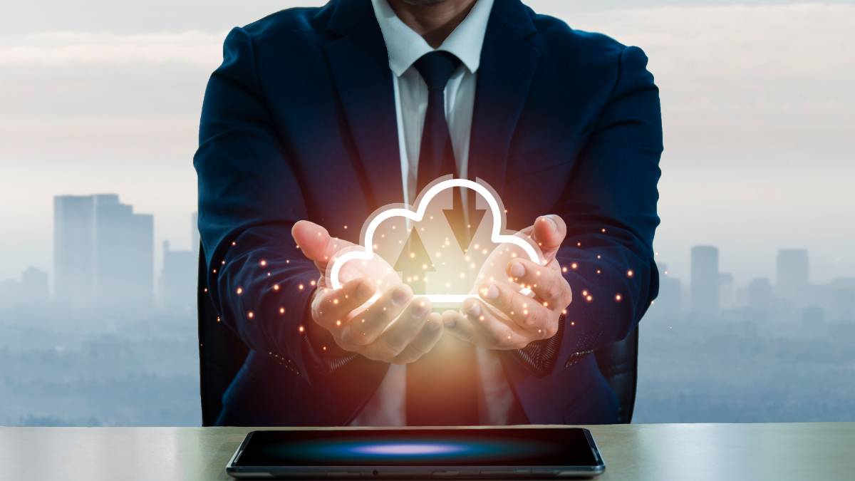 Custom-cloud-solutions Businessman holding digital cloud in his hands
