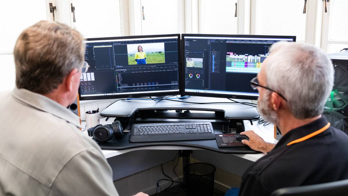 Where-to-save-your-video-content 2 video editors looking at editing suite screens