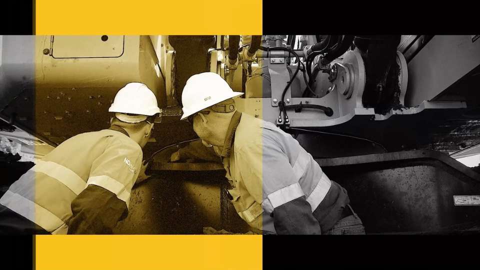 Thumbnail of 2 technicians working on an engine, with yellow overlay over one third of image
