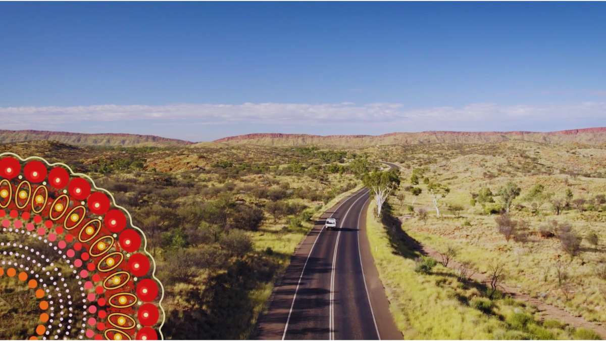 Video-graphics Video graphic overlay of aboriginal artwork over vehicle on desert road
