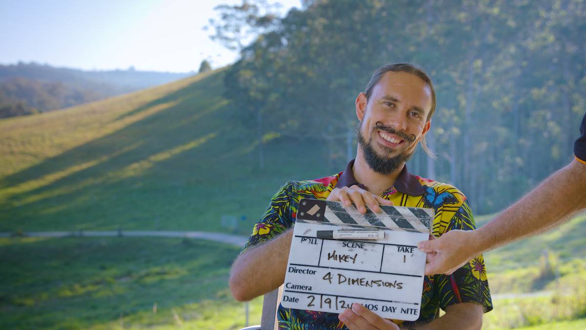 How-and-where-to-add-videos-to-your-website Man being filmed for website video holding h video clapper